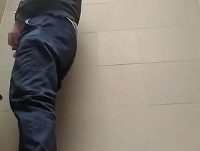Young guy peeing with his uncut cock in a highway toilet