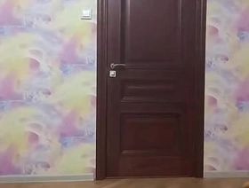 Crossdresser smokes and poses in long tight dress